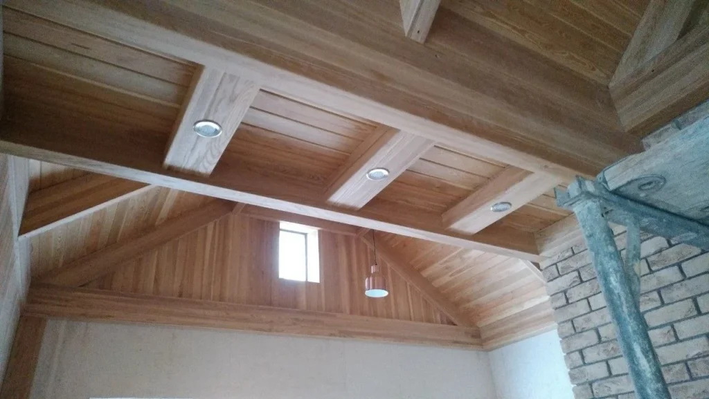 Attic converted to a bedroom, lined and finished, with a rooflight above the bed