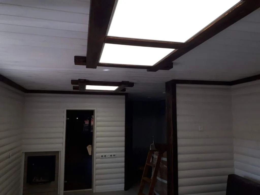 Two rooflights fitted into a ceiling in a room still being built
