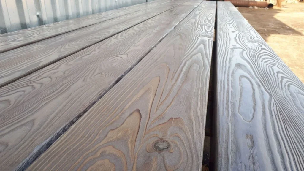Close view of a knot and chevron joint in finished timber