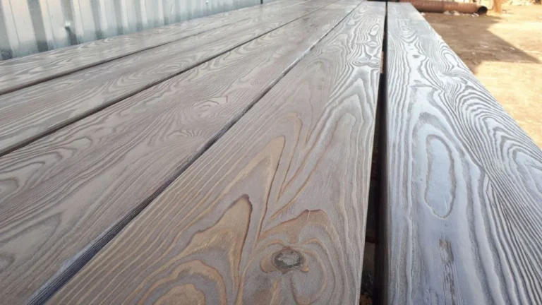 Close view of a knot and chevron joint in finished timber