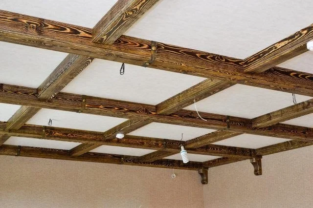 Heavy timber grid ceiling cut and fitted in a converted attic